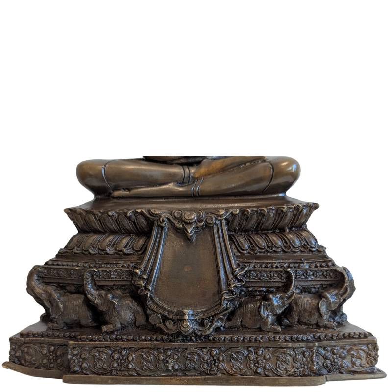 Close view of the elephant-supported pedestal with lotus and floral ornament
