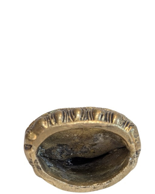 Natural aged patina and surface wear on the Nepalese bronze Buddha
