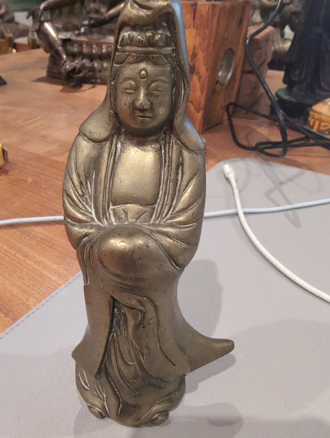 Standing Chinese Guanyin figure showing the headdress, serene facial features and flowing robes