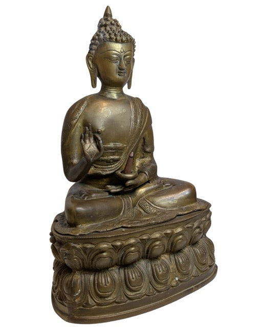 17th–18th Century Tibetan Fire-Gilt Bronze Buddha – left three-quarter rear view