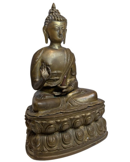 17th–18th Century Tibetan Fire-Gilt Bronze Buddha – left three-quarter rear view
