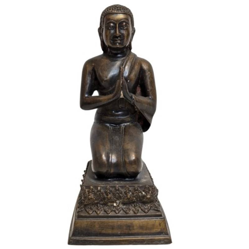 Joined hands of the kneeling bronze Buddha in Anjali Mudra