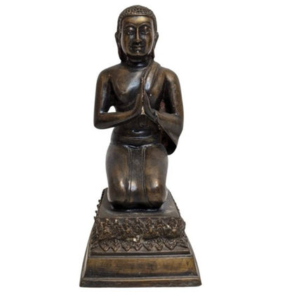 Joined hands of the kneeling bronze Buddha in Anjali Mudra