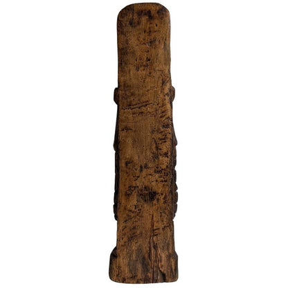 Elaborate courtly robes carved into the teak sculpture
