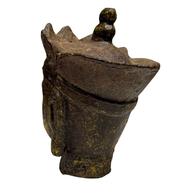 Dark iron patina beneath surviving gold leaf