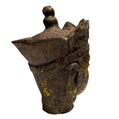 Pair of Chinese gilt iron Buddhist heads displayed together