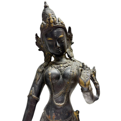 Close-up of Himalayan bronze Tara showing the crown, jewellery and raised hand gesture