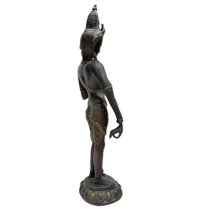 Rear three-quarter view of Himalayan standing Tara showing the draped garment and hand gesture
