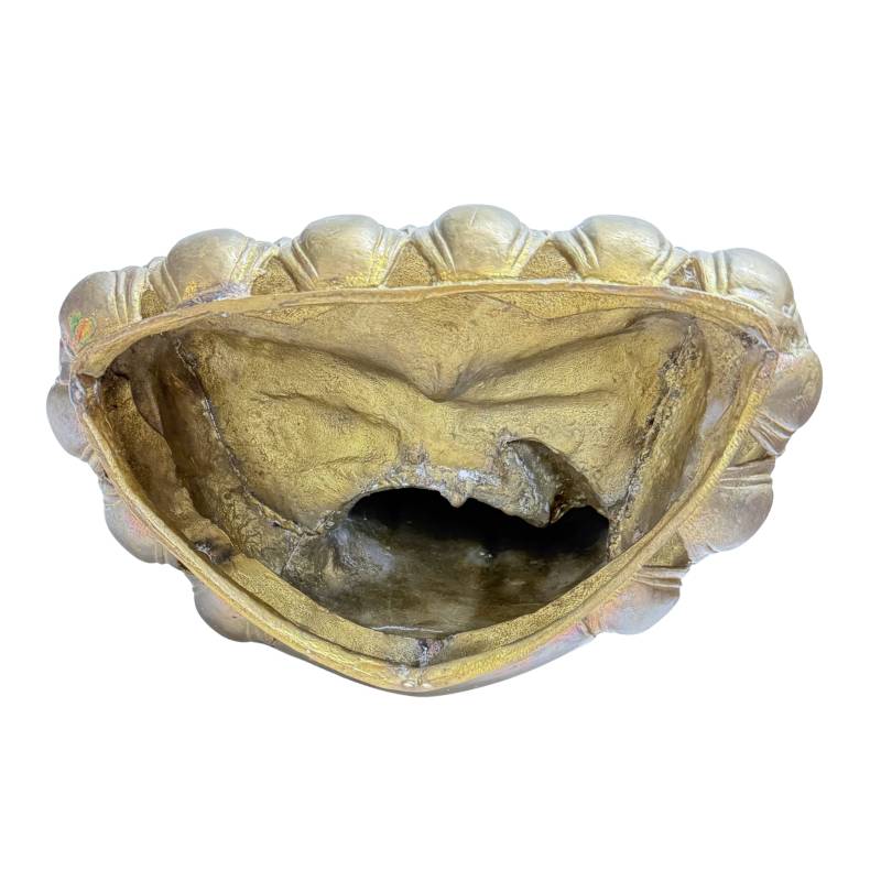 Open underside showing the hollow casting and rough interior walls