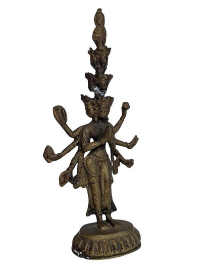 Warm aged fire-gilt surface of the Tibetan Avalokiteshvara