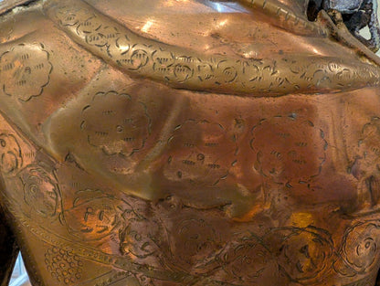 Close-up of engraved floral and circular motifs across Tara's thigh