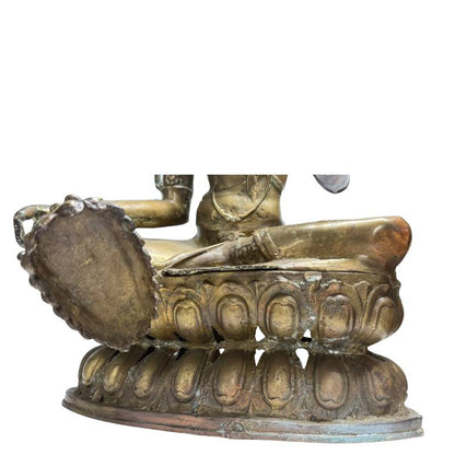 Close-up of Green Tara's extended foot and double lotus throne