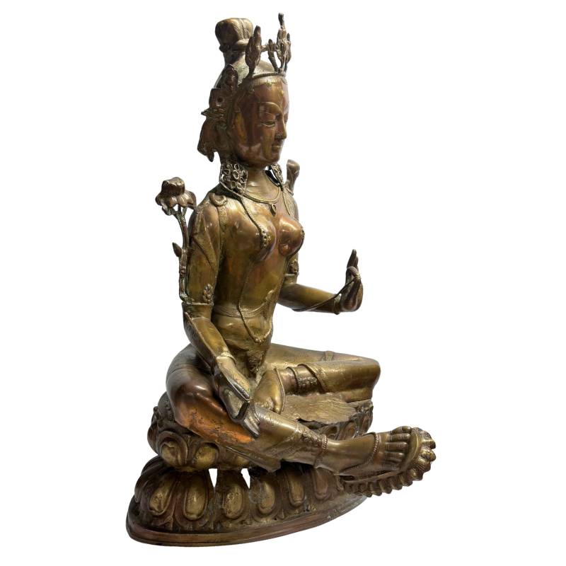 Front angle of Tibetan Green Tara in relaxed royal posture