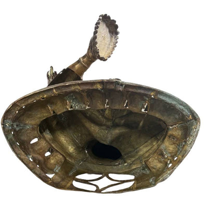 Open underside showing the large hollow-cast interior of the Green Tara sculpture