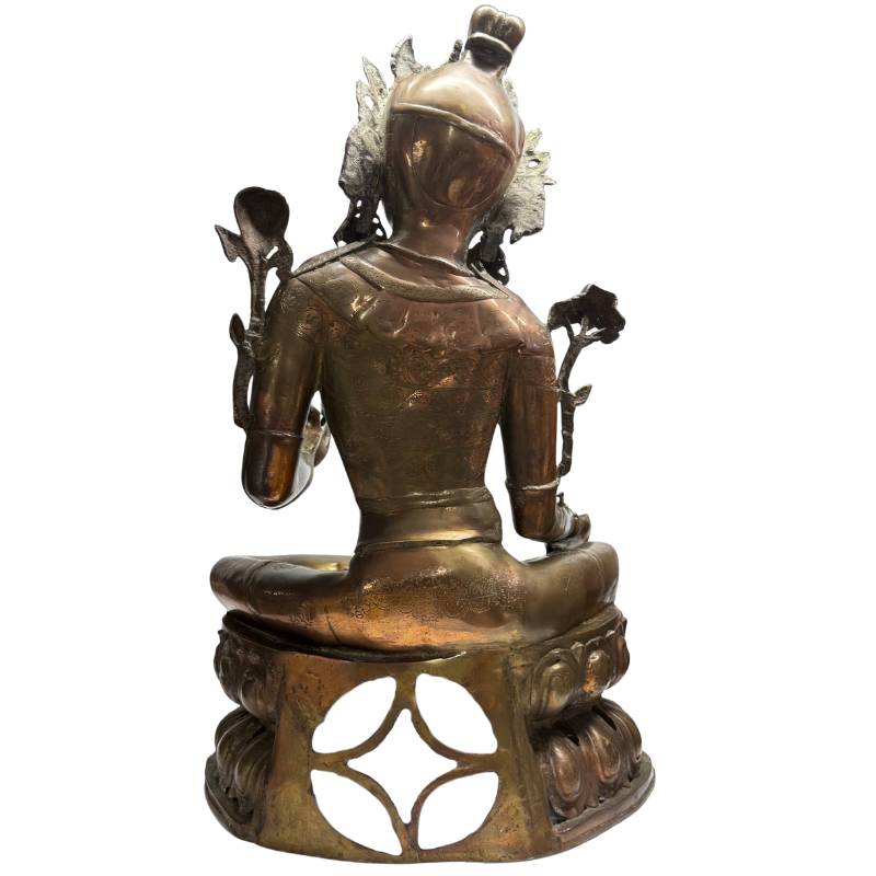 Rear view of Green Tara showing the openwork lotus throne and reddish bronze surface
