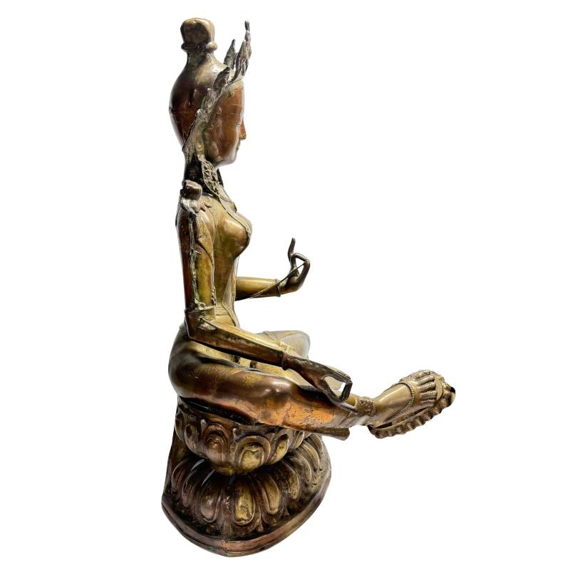Side view of Green Tara showing extended right leg and lotus throne