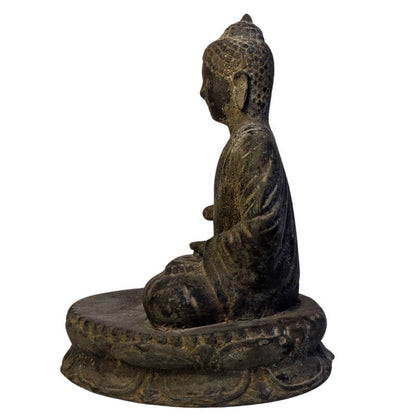 Antique Cambodian Buddha figure in the earth-touching gesture