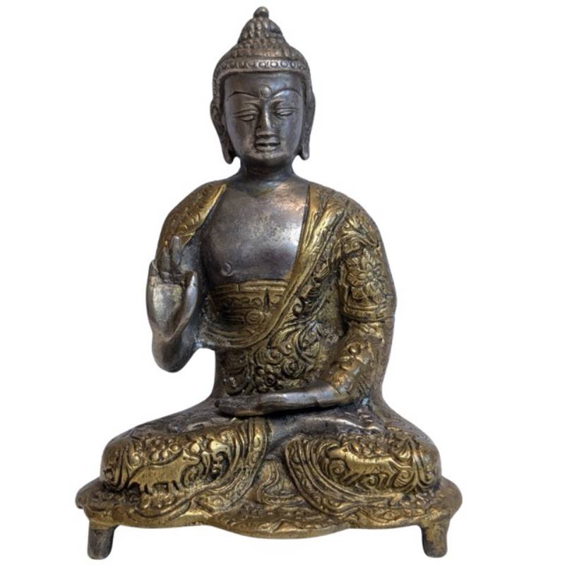 Raised right hand of the Nepalese Buddha in Vitarka Mudra