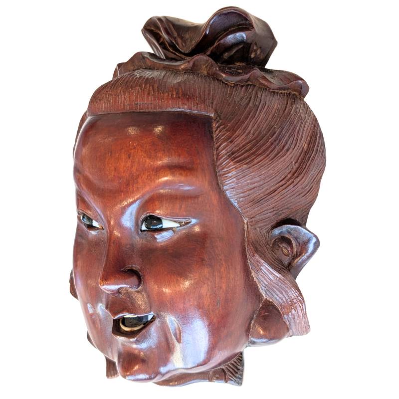 Carved wooden Guanyin mask head showing the inlaid eyes