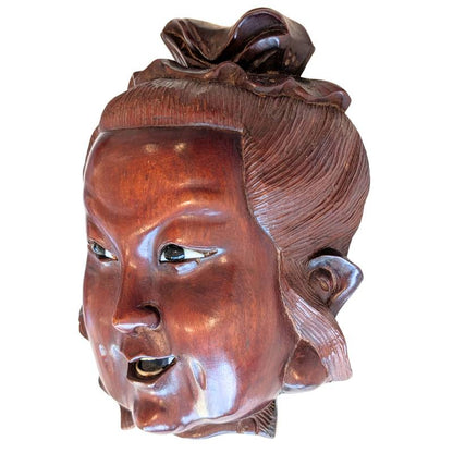 Carved wooden Guanyin mask head showing the inlaid eyes
