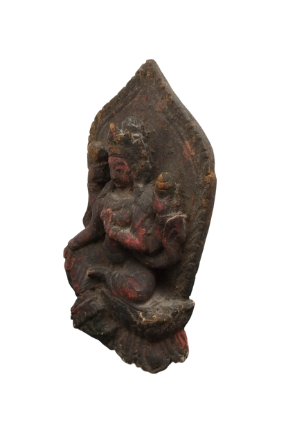 Original red pigment traces and natural age patina on the wooden Tara