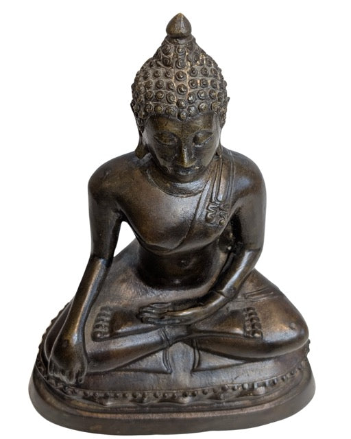 Old clay traces and oxidation visible at the Buddha base