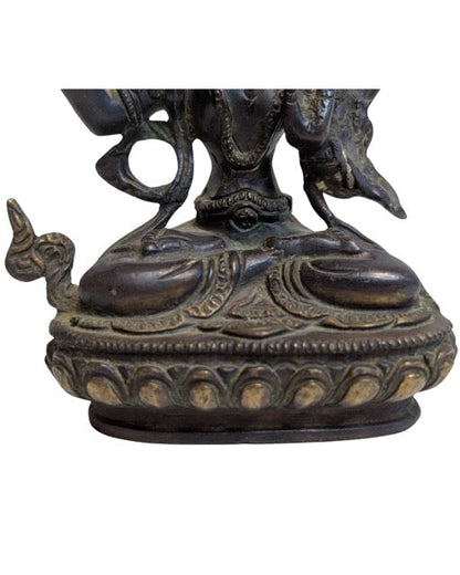 Manjushri seated in Padmasana on a lotus base