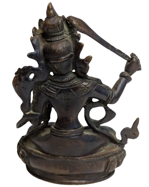 Manjushri holding the sword of wisdom in his right hand