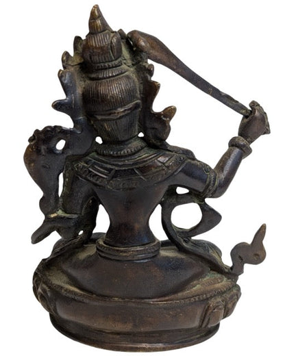 Manjushri holding the sword of wisdom in his right hand