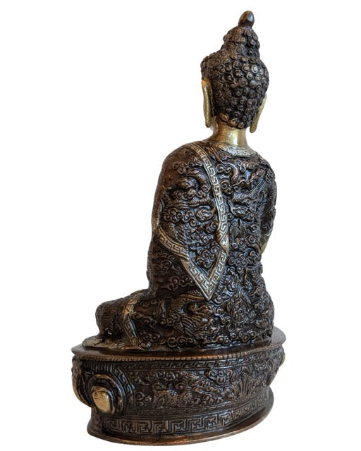 Shakyamuni Buddha seated in Bhumisparsha Mudra on a lotus base