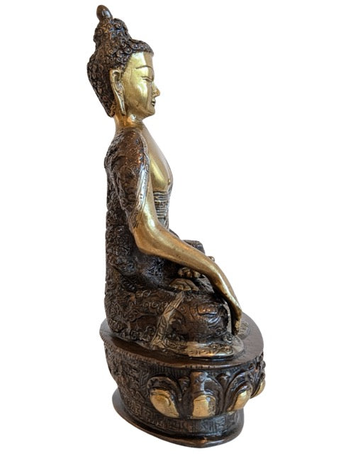 Naturally worn gilding on the bronze Shakyamuni figure