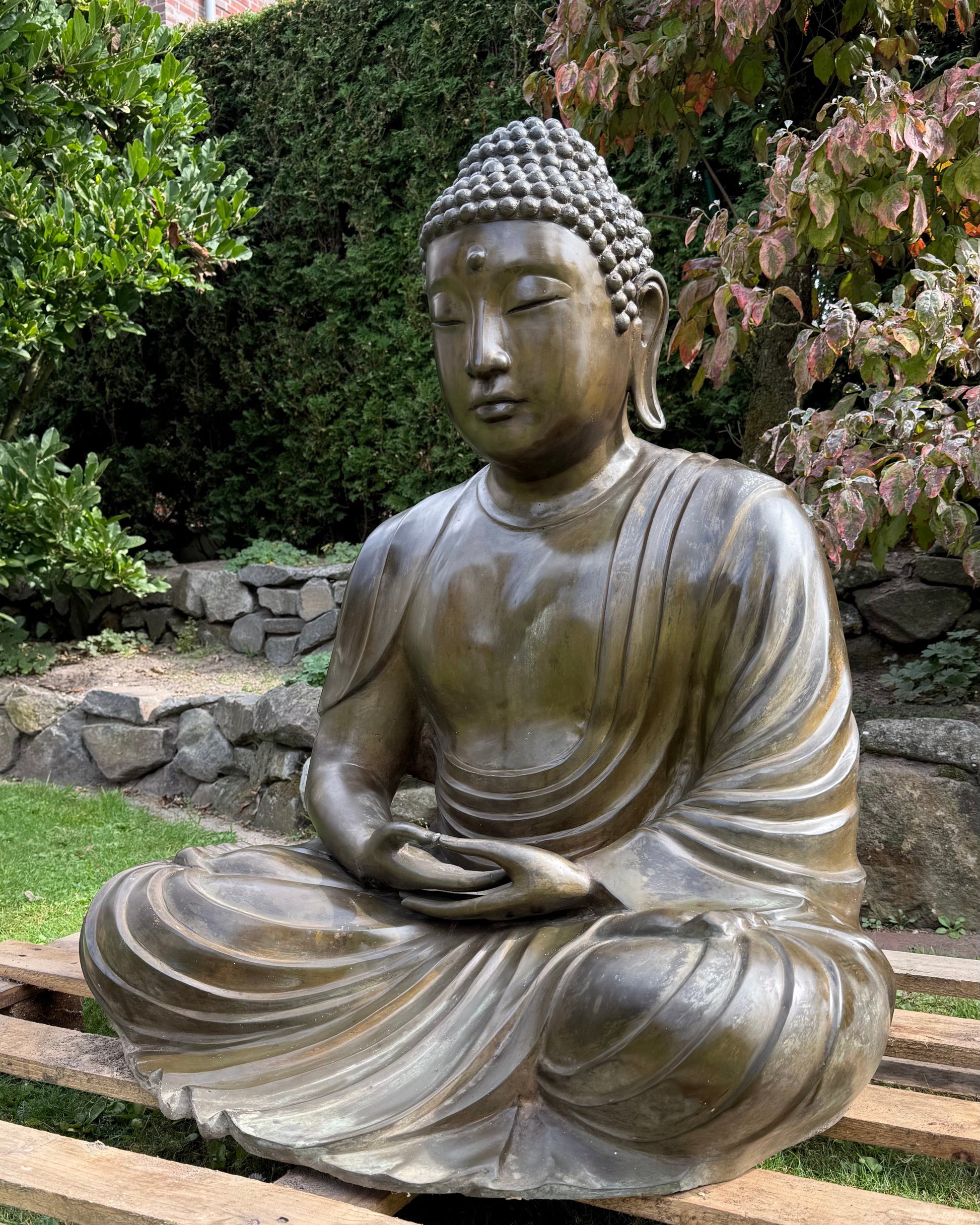 Serene face of the Japanese Amida Amitabha Buddha with half-closed eyes
