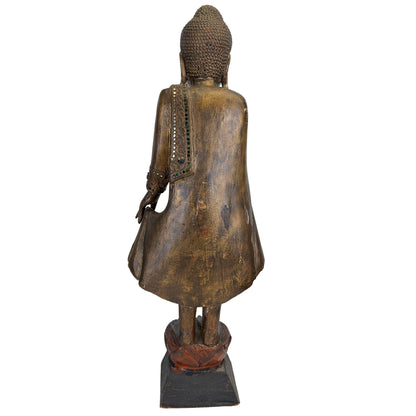 Rear view of the Burmese standing Buddha showing mirror-glass inlay along the robe