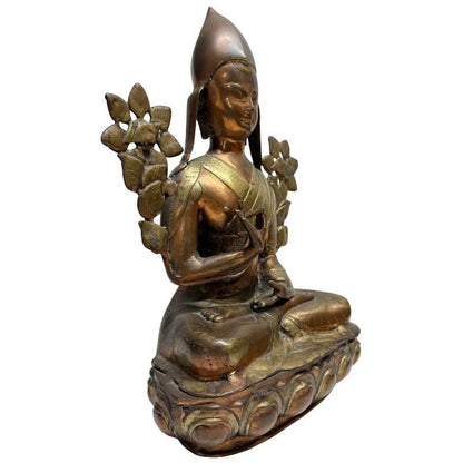 Antique gilt bronze Tsongkhapa, front-left view with paired lotus flowers