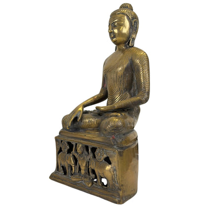 Front left three-quarter view of the antique Himalayan bronze Buddha and altar-like base