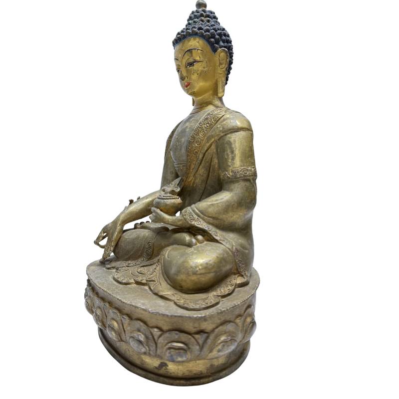 Three-quarter front view showing the Medicine Buddha vessel and lotus base