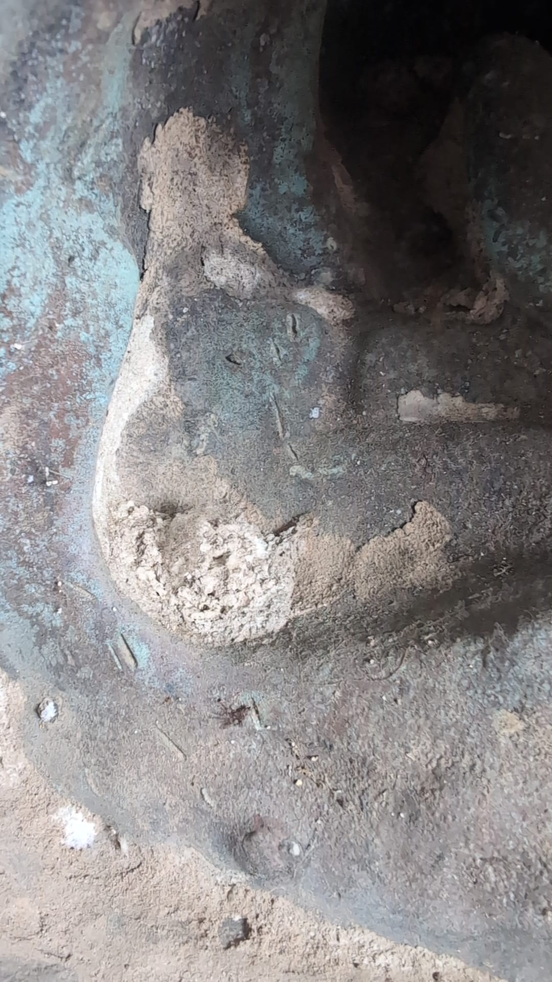 Interior inspection showing thick bronze casting and mineral deposits