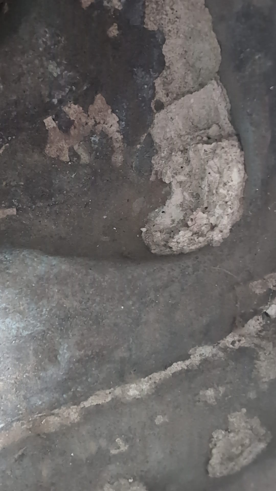Interior inspection showing oxidation and deposits inside the bronze sculpture