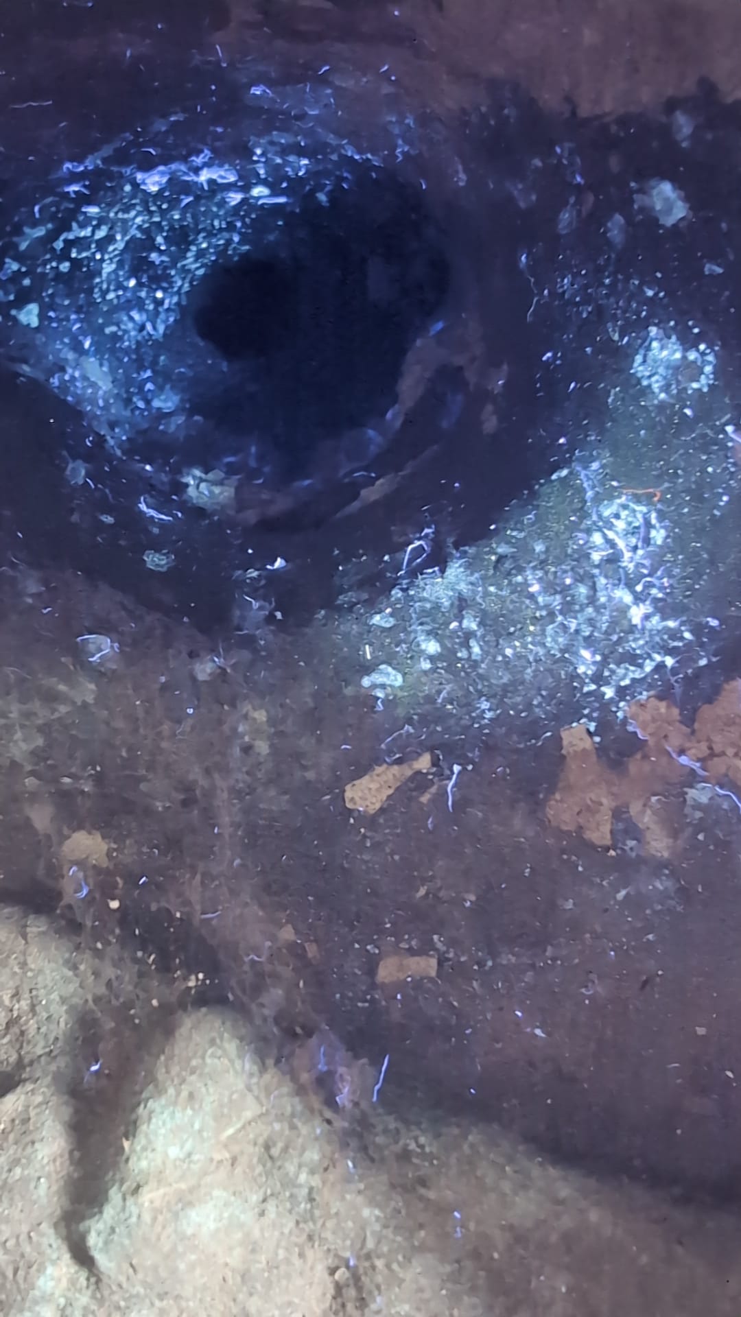 Close-up of dark interior cavity and aged casting surface