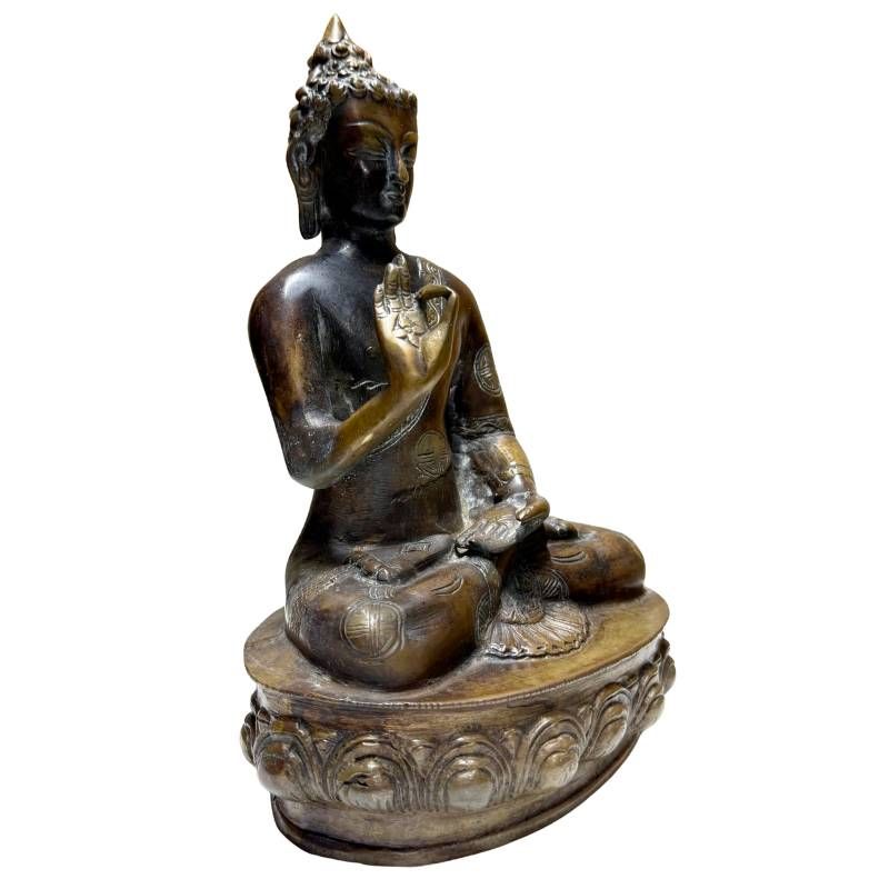 Antique Nepalese bronze Buddha in Vitarka Mudra, front-left view