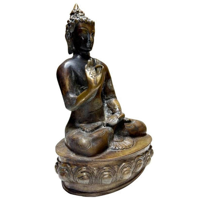 Antique Nepalese bronze Buddha in Vitarka Mudra, front-left view