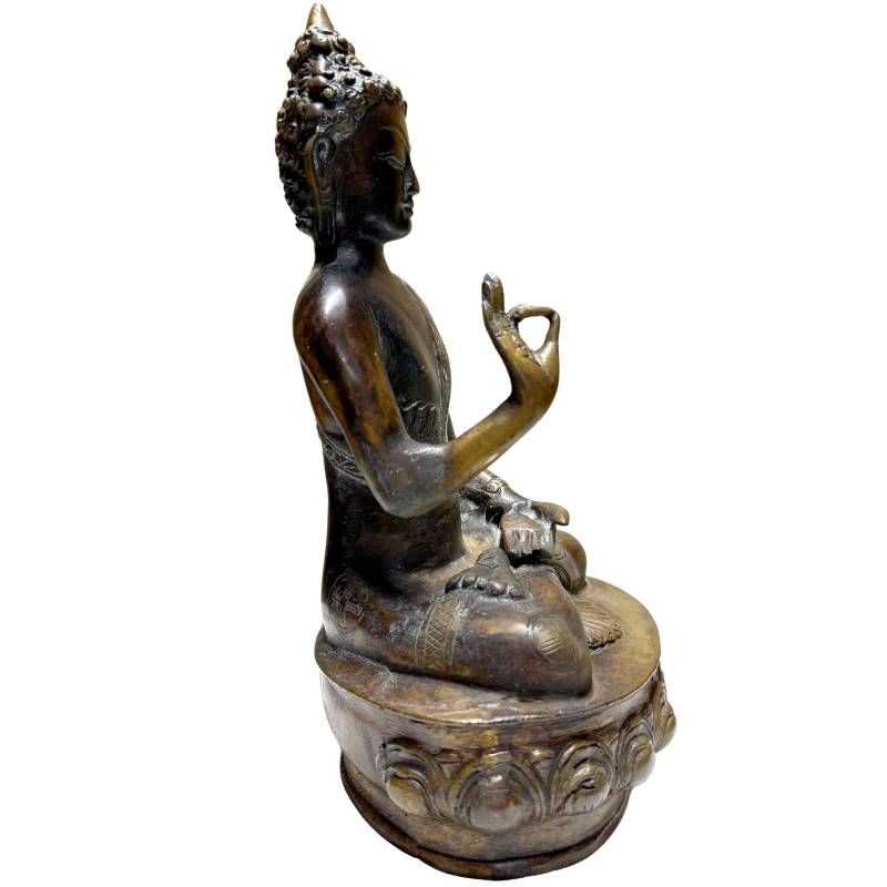 Antique Nepalese bronze Buddha, left profile showing raised teaching hand