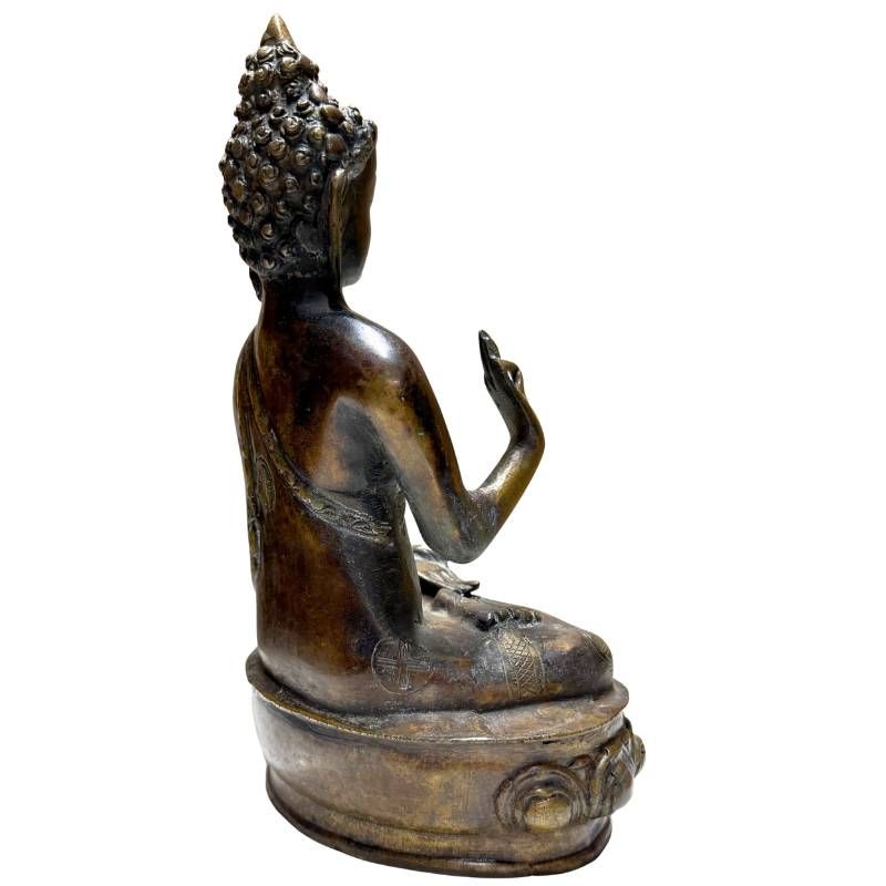 Antique Nepalese bronze Buddha, rear-left view with engraved robe border