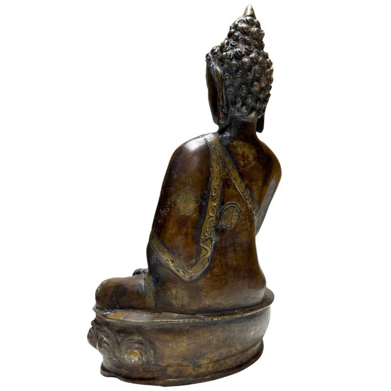 Antique Nepalese bronze Buddha, rear-right view showing robe decoration