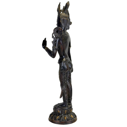 Rear three-quarter view of the antique Nepalese Green Tara with lotus stem and aged surface