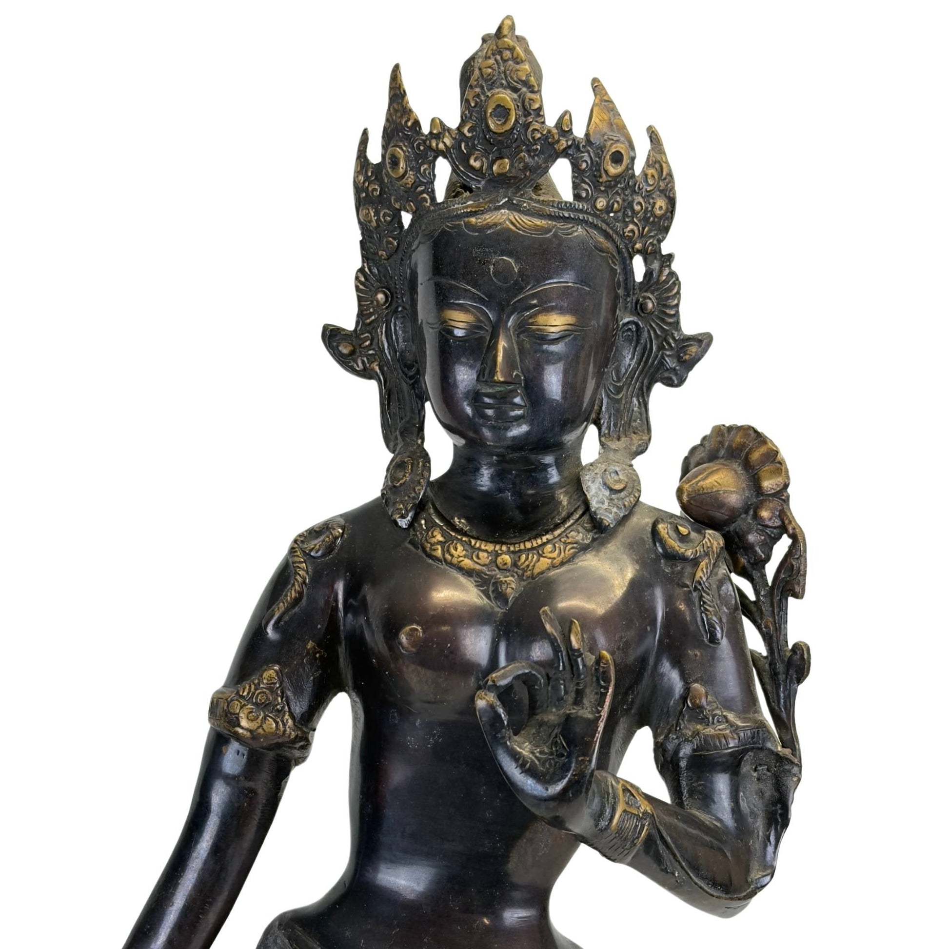 Left front view of the antique Nepalese Green Tara with chased garments and lotus stem