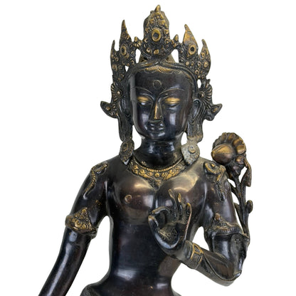 Left front view of the antique Nepalese Green Tara with chased garments and lotus stem