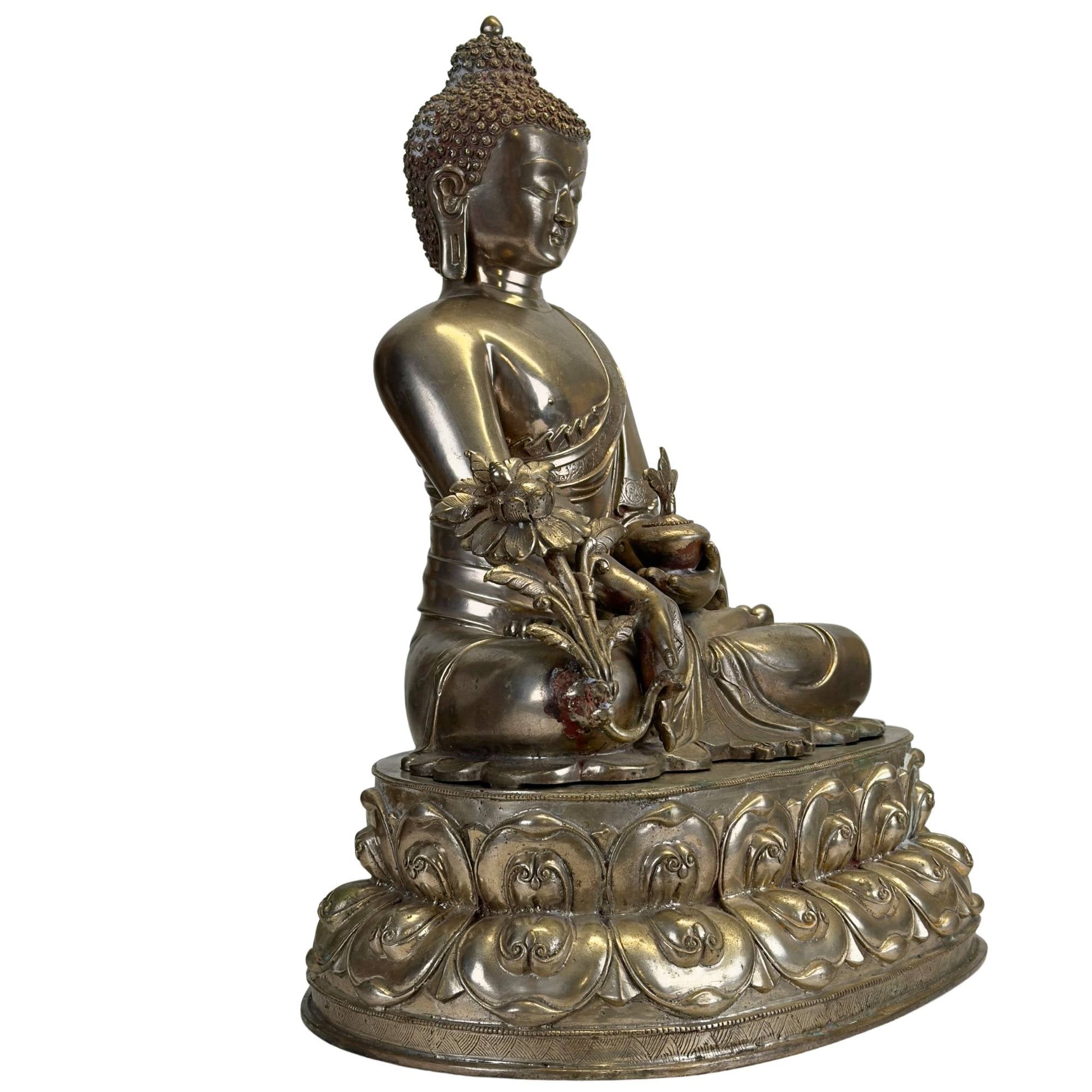 Silvered Bhaisajyaguru on a double lotus throne with medicinal plant, three-quarter view