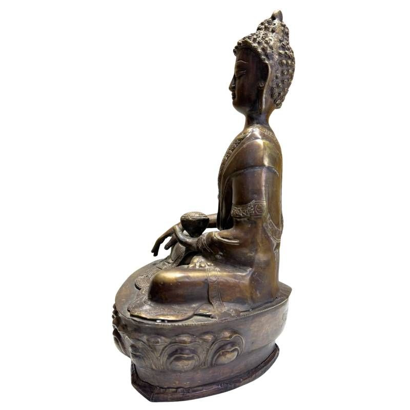 Antique Sino-Tibetan bronze Medicine Buddha, right profile on lotus base