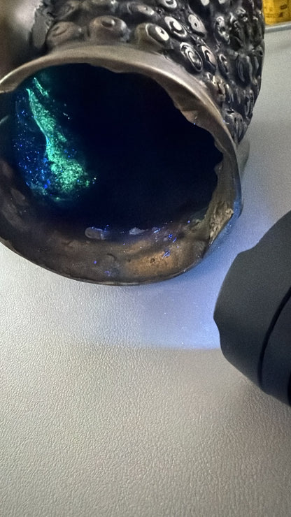 Ultraviolet surface study of the interior of the antique Thai bronze Buddha head